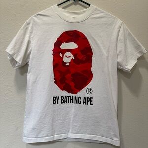 A Bathing Ape White Tee with vibrant camo design Size S.